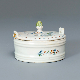 A polychrome Brussels faience 'à la haie fleurie' butter tub and cover, 18th C.